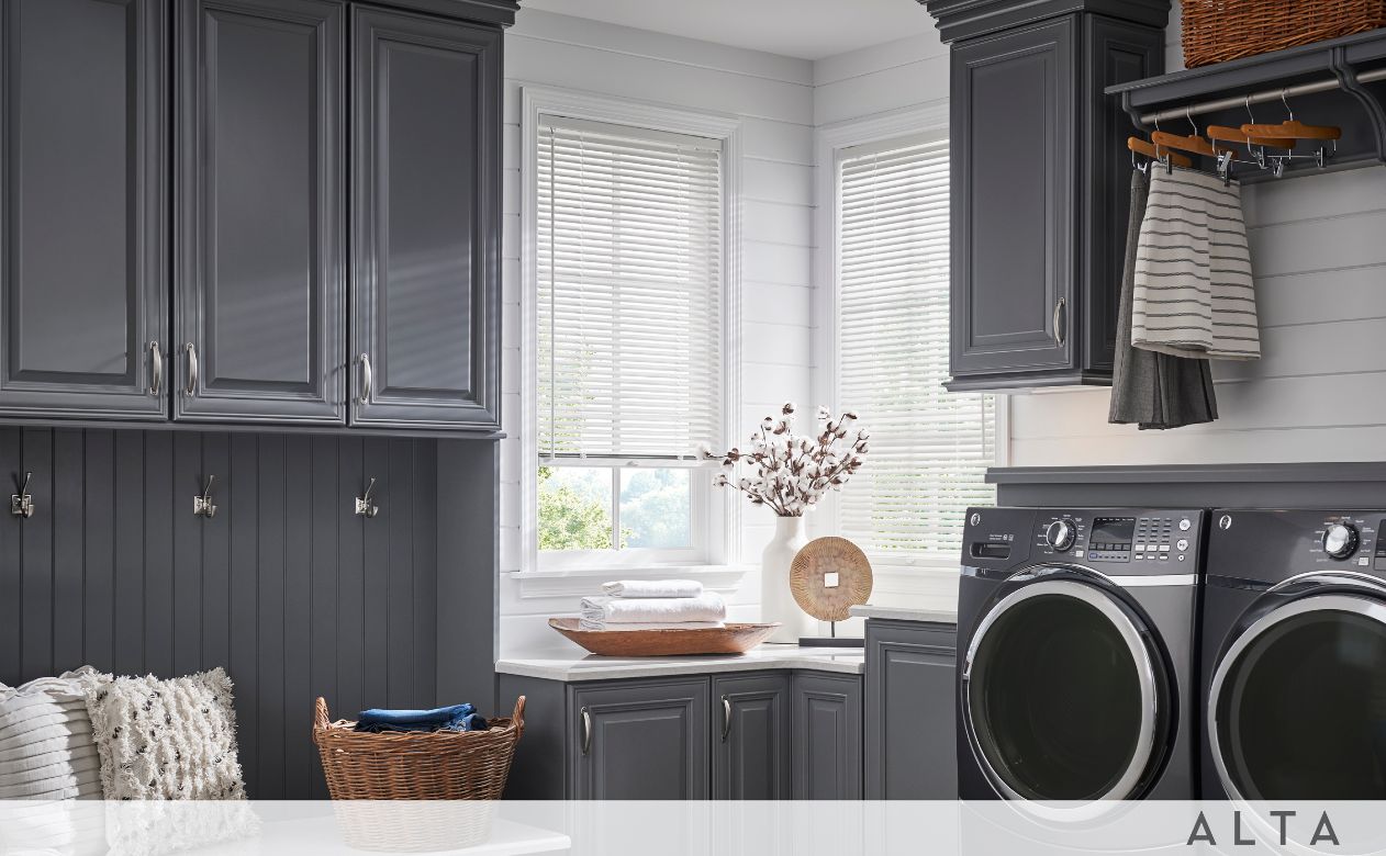 Shade-O-matic blinds in a modern laundry room with dark grey cabinets